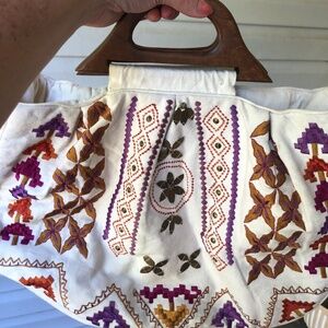 Embroidered handbag with wooden handles